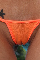 Laura Lee in sheer bikini spreading out on floating island