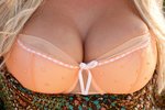 Abbey Brooks popping her peaches out of her peach colored lingerie