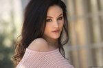 Logan Drae undresses in a shady spot