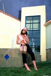 Elle Williams takes off her clothes by a fountain