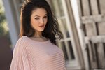 Logan Drae undresses in a shady spot