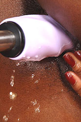 Ebony babe on fucking machine