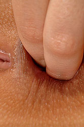 Horny blond fingers her ass