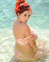 Lucy V Strips From Her Floral Bikini In the Pool
