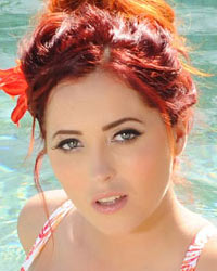 Lucy V Strips From Her Floral Bikini In the Pool
