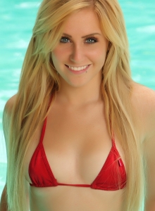 Alluring Vixens: Blonde Alluring Vixen babe Ashley Vallone teases in the pool wearing a very skimpy red string bikini