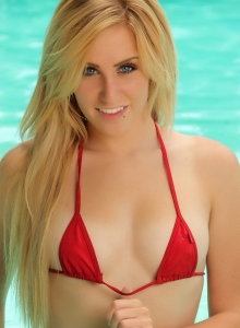 Alluring Vixens: Blonde Alluring Vixen babe Ashley Vallone teases in the pool wearing a very skimpy red string bikini