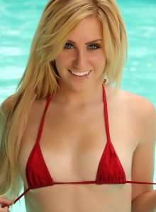 Alluring Vixens: Blonde Alluring Vixen babe Ashley Vallone teases in the pool wearing a very skimpy red string bikini