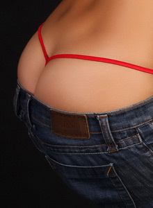 Alluring Vixens: Alluring vixen Kira looks stunning as she's topless with just tight jeans and a red g-string
