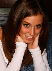 Alluring Vixens: Super cute vixen Leah relaxes in bed as her perky teenage breasts almost fall out of her loose fitting top