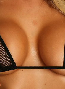 Alluring Vixens: Megan Daniels teases with her huge boobs in a zipper bikini