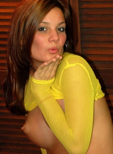 I Want Katie: Super cute Katie teases with her big tits in a very bright yellow fishnet top