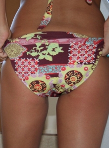 I Want Katie: Tanned teen Katie isn't shy when it comes to showing off her tight round ass when she pulls down her bikini bottoms for the camera