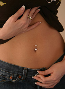 Jana Rocks: Sexy blonde teen Jana strips down to her tiny g-string before getting into bed