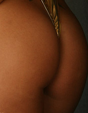 Amber Jean dazzles in a shiny gold one piece that shows off her perfect ass 