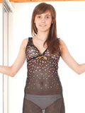 Nubiles.net Daisy - Alluring teen stunner in fishnet stockings gently squeezing her lovely tits while flirting on the camera