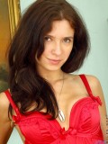 Nubiles.net Iraina - Horny Nubile Iraina takes off her sexy red undies and posing her naked body on top of the table