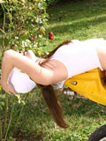 Nubiles.net Jenny - Long haired hottie jenny sits on her mini bike and spreads her legs open