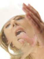 Pretty blonde pisses into a glass bowl