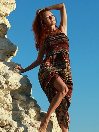 Petite young redhead girl getting nude on the beach
