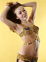 Exotic dancer girl takes off her costume