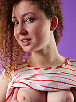 Curly babe with big tits Daisy loves to take off her clothes