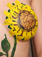 Stimulating Jasmin with sunflower painting on her nude and flat tummy