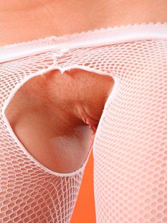 Daisy in zigzag dress and torn fishnet stockings with her cunt exposed