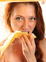 Cute hungry Kesy with sexy lean body is eating fruit in a sexy way