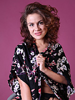 Nora likes to pose in sexy lingerie and stockings and to strip on camera