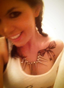 Diddylicious: Diddy isn't shy as she shows off her little round ass, perky tits and new tattoo in her candid pictures