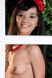 Smiling brunette teen posing in the white stockings and belt