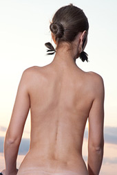 Tall perfectly shaped teen standing naked on the balcony of the hotel