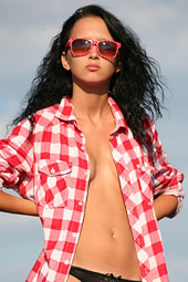 Skinny brunette jumping naked on the street