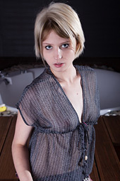 Bewitching and short haired blonde with small mammaries is showing her tits