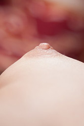 Redhead and short haired bimbo with nubile pussy is showing her small nipples