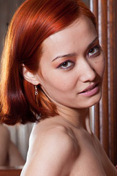 Redhead and short haired bimbo with nubile pussy is showing her small nipples