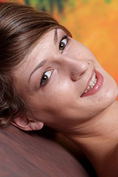 Amateur and daring angel with nice smile is posing on the floor