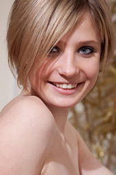 Short-haired cutie checks out her awesome body before getting dressed