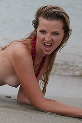 Dirty blond teen bitch going wild as she enjoys sand over her body