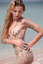 Dirty blond teen bitch going wild as she enjoys sand over her body