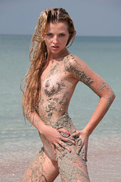 Dirty blond teen bitch going wild as she enjoys sand over her body