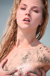 Dirty blond teen bitch going wild as she enjoys sand over her body