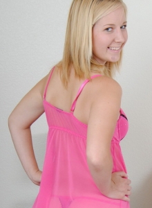 SpunkyAngels: Perky blonde teen Ember shows off her perfect round ass while striping out of her sexy pink lingerie