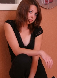 SpunkyAngels: Perky tease Kir shows off her tight round ass in a tiny thong as she gets topless