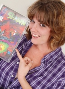 SpunkyAngels: Curvy nerdy tease Misty exposes her natural big tits as she shows off her comic book collection