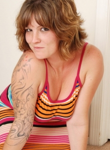 SpunkyAngels: Tattooed babe Misty shows off her curves as she strips out of her striped covered dress with no panties on underneath