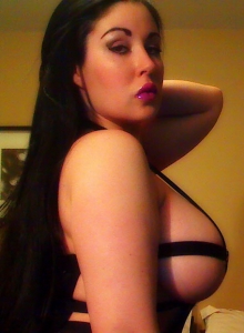 Sweet Krissy: Busty babe Sweet Krissy shows off her big juicy tits in a skimpy black bandages dress