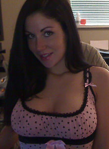 Sweet Krissy: Krissy shows off her big tits as she pulls them out of her little lingerie top and plays with them