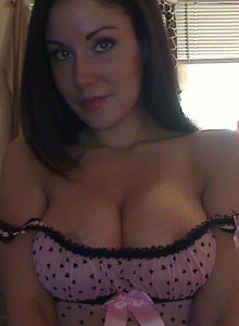 Sweet Krissy: Krissy shows off her big tits as she pulls them out of her little lingerie top and plays with them